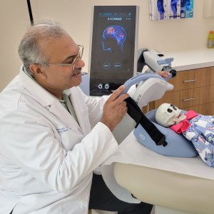 Dr. Jehangir Gowani Consulting with a Patient for TMS Therapy in Frisco TX Dr. Jehangir Gowani Consulting with a Patient for TMS Therapy in Frisco TX